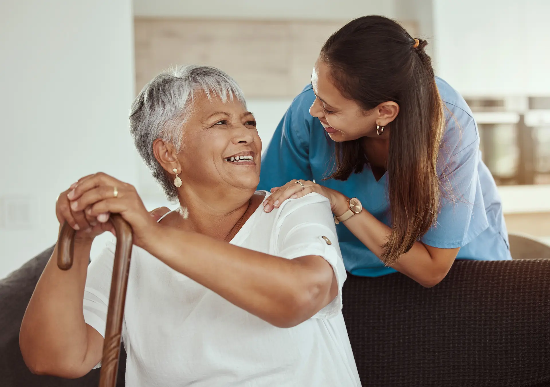 Professional nurse helping elderly lady